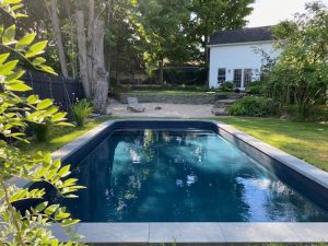 Beautiful backyard with a vinyl inground pool.