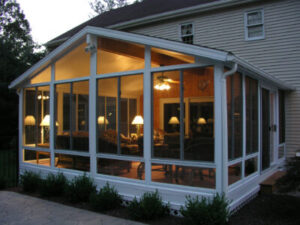 view of sunroom at night