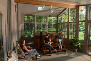 view inside a sunroom with three women relaxing and enjoying