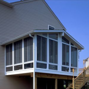 Simple, studio sunroom installed on a residential home.