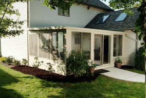 An outdoor patio was converted into a beautiful studio sunroom.